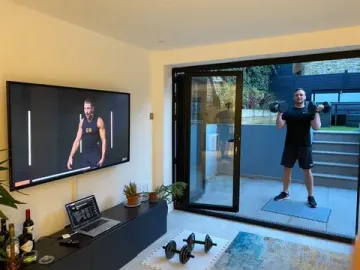 Member working out in a garden room